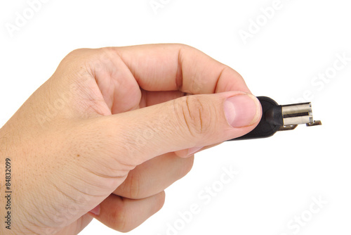 Hand holding a security key isolated on a white background