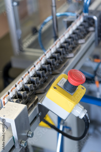 Closeup of Stop button on the assembly line