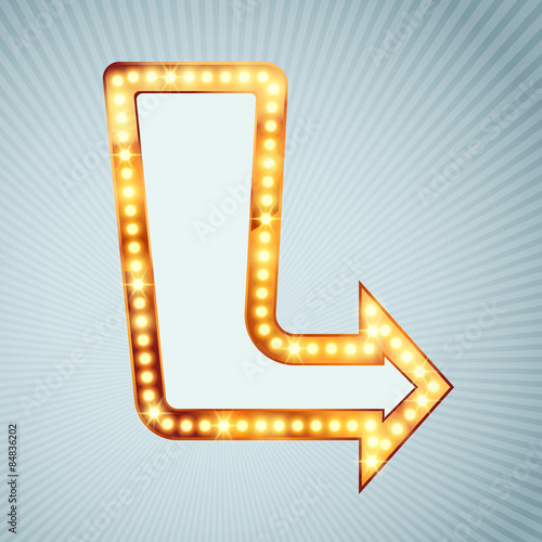 Bright light bulb pointing arrow sign