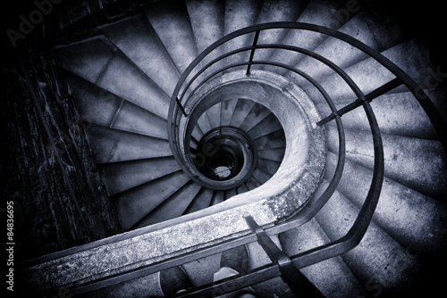 Spiral Staircase Winding Down in Historic Building #84836695