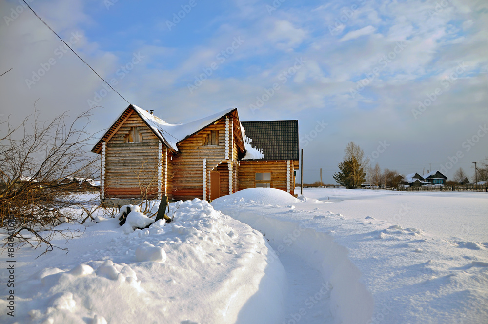 Russian log house in winter. Ural region. Visim, Russia
