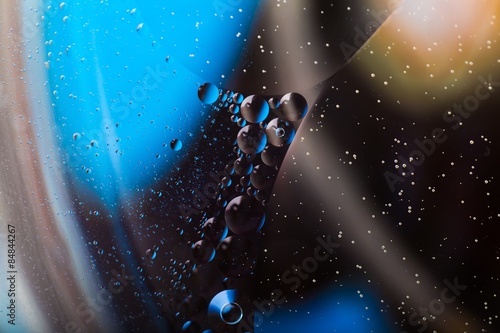 Abstract background of oil droplets on water surface
