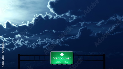 Passing under Vancouver Canada Transcanada Highway Road Sign at Night
  
