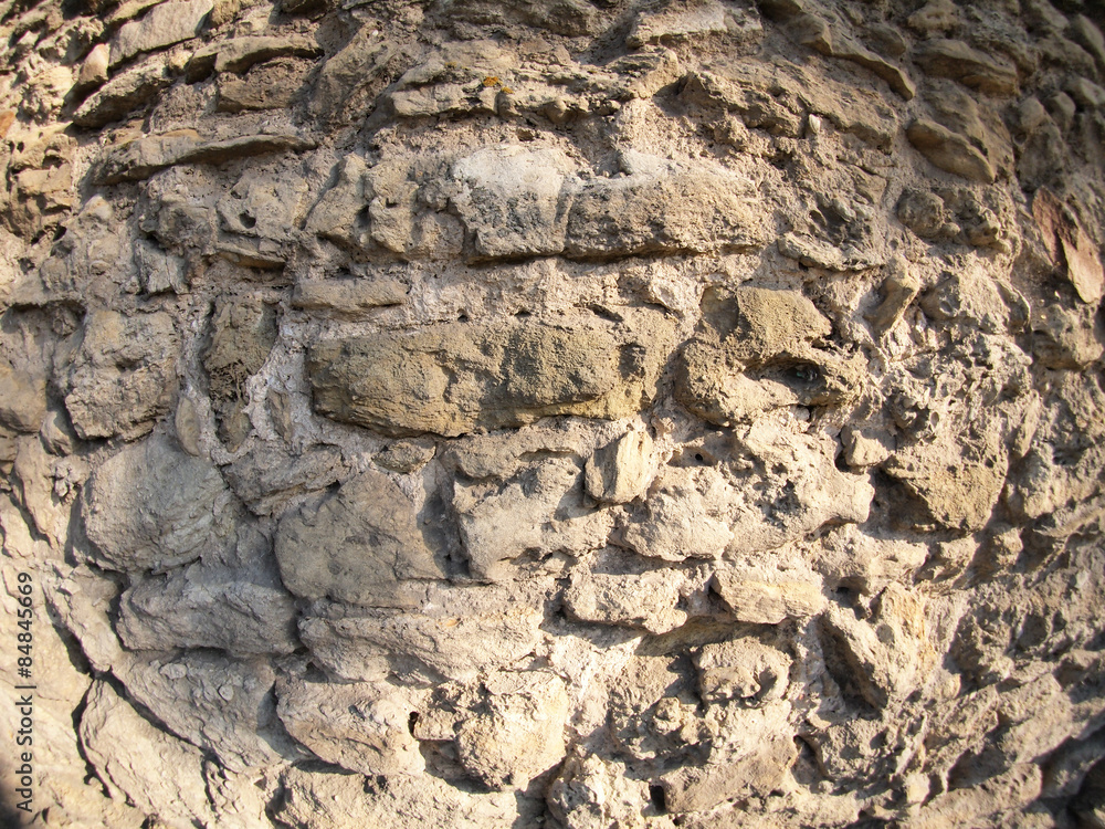 Stone wall of the large rough stones gray Stone wall of the large rough stones gray