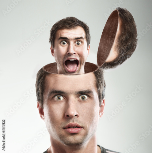 Concept of man screaming inside his opened head photo