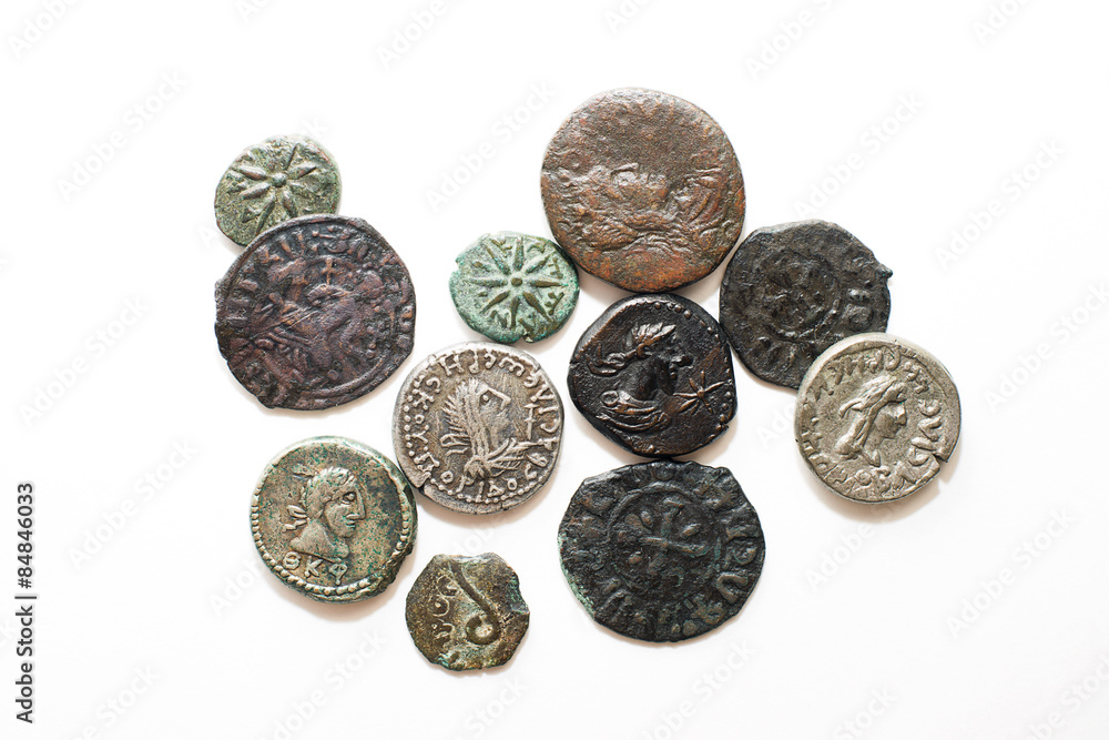 Vintage coins with portraits of kings on a white background