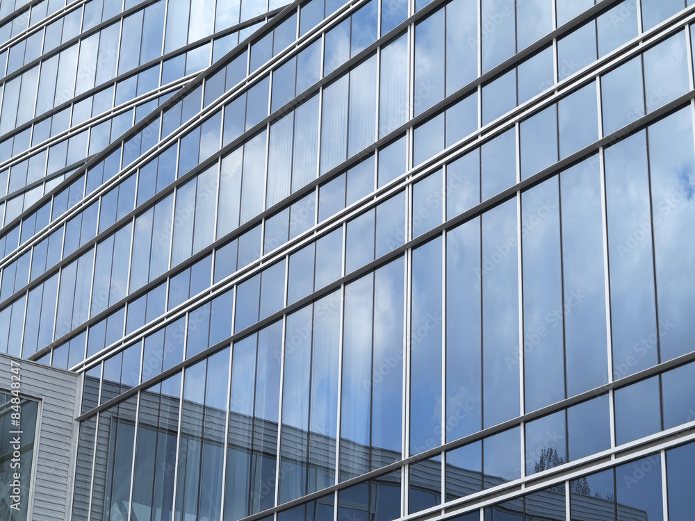Abstract blue glass facade modern business center building