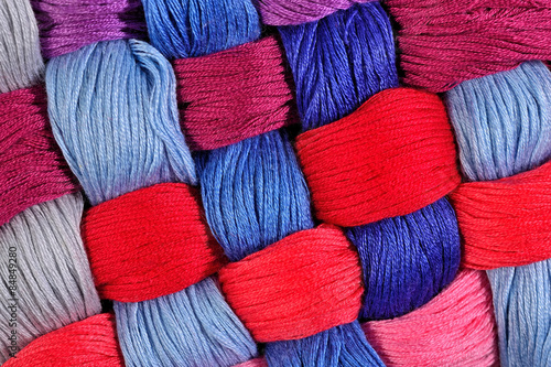 Colorful twisted skeins of floss as background texture