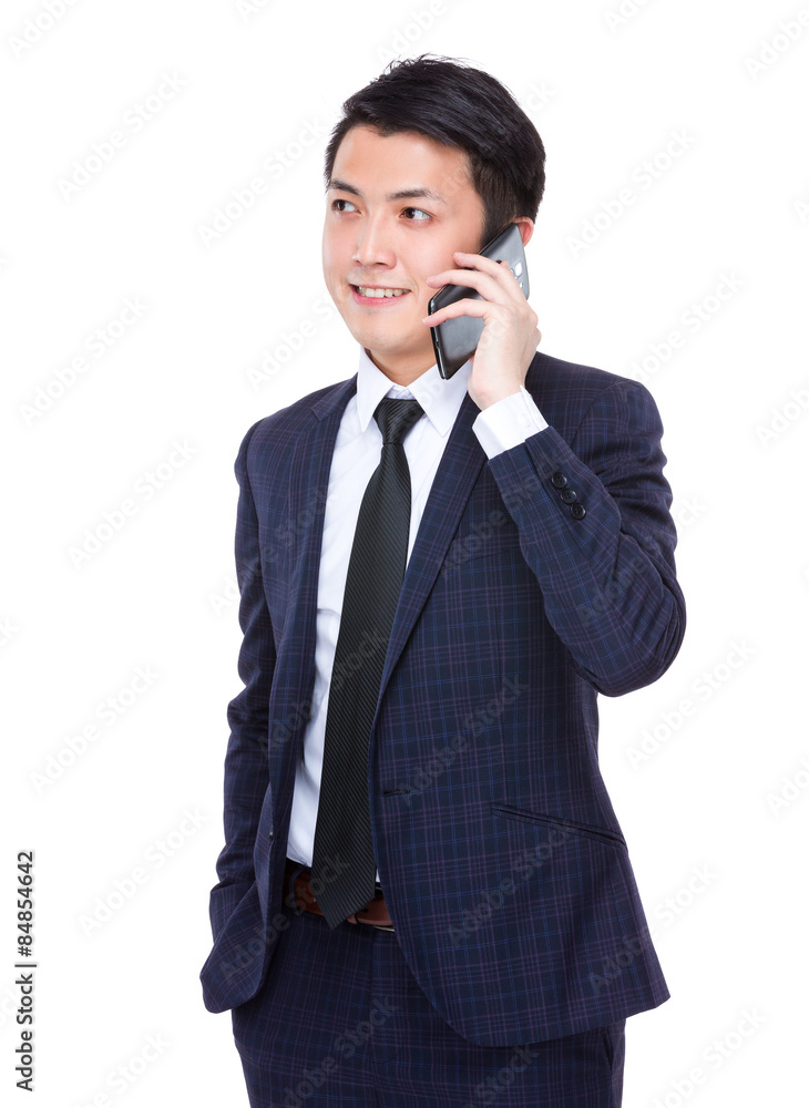 Asian businessman talk to cellphone Asian businessman talk to cellphone