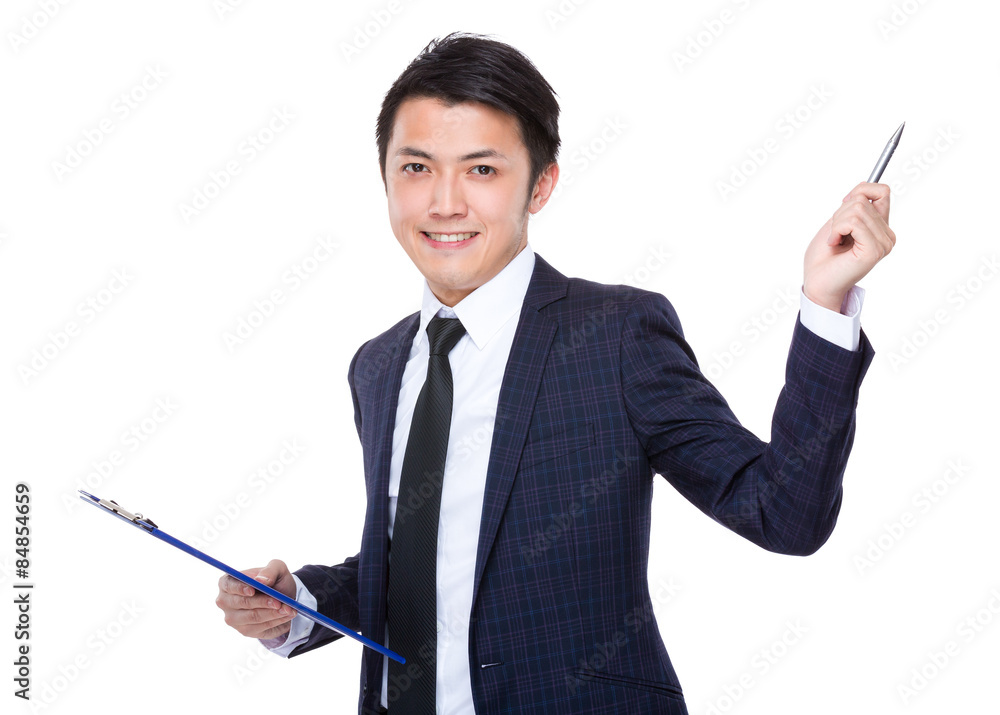 Young businessman holding with clipboard and pen point up Young businessman holding with clipboard and pen point up