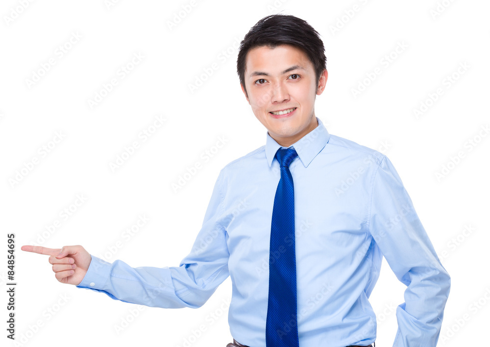 Young businessman with finger point aside Young businessman with finger point aside