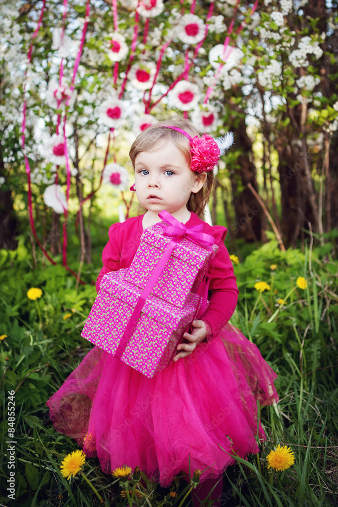 little girl with birthday presents