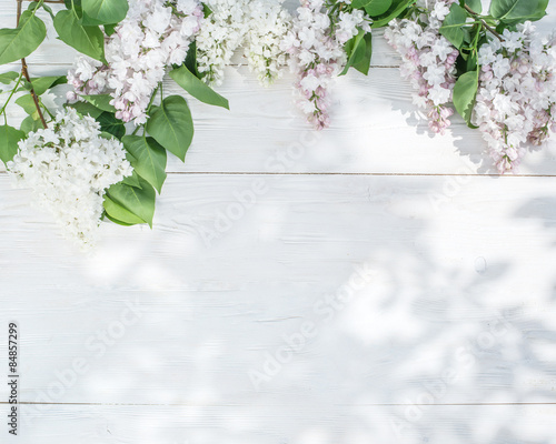 Fototapeta Naklejka Na Ścianę i Meble -  Blooming lilac flowers on the old wooden table.