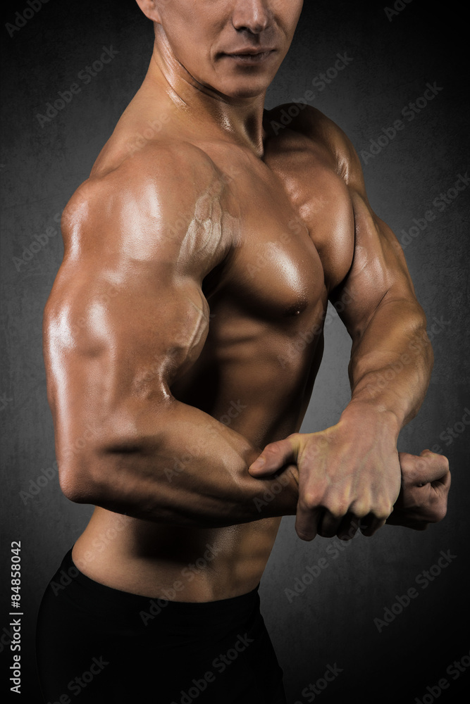 Muscular man showing bicep