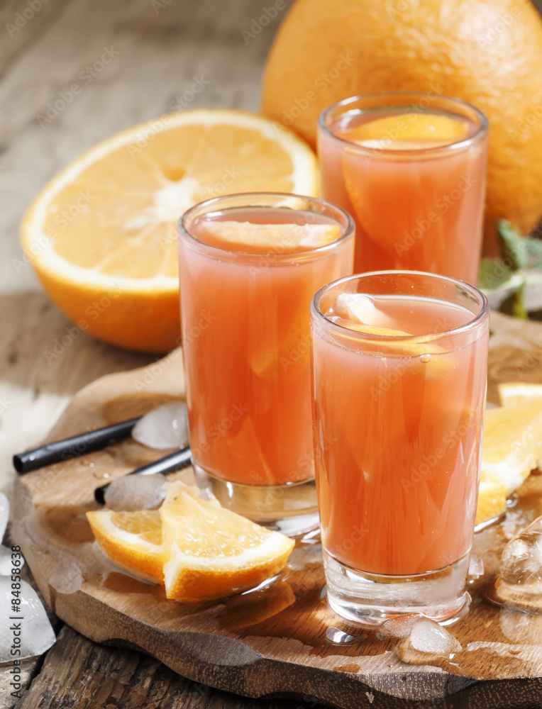 Freshly squeezed juice from red orange, selective focus Freshly squeezed juice from red orange, selective focus