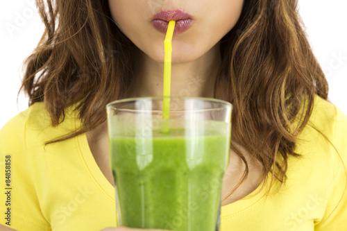 Woman drinking green smoothie