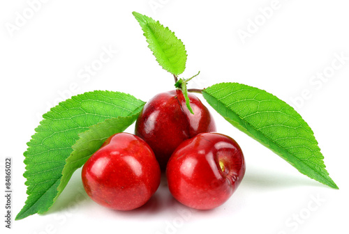 Sweet Cherry with stem and leaf on white background