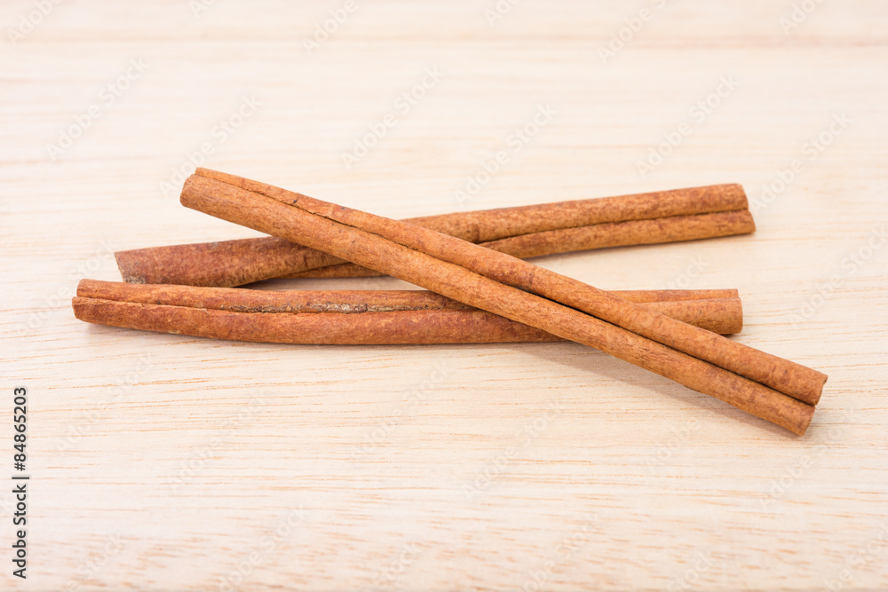 Cinnamon sticks on wooden table Cinnamon sticks on wooden table