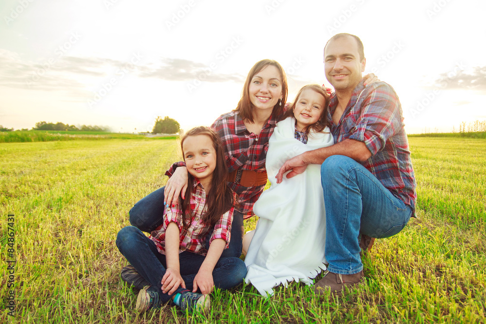 family in the field. Concept of happy family
family in the field. Concept of happy family