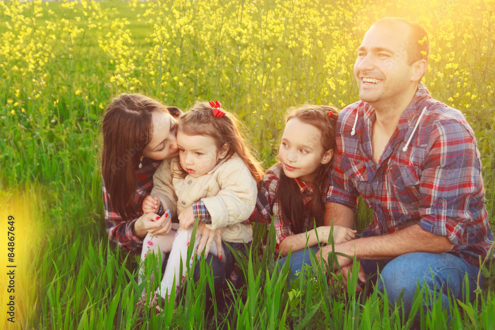 Fototapeta premium family in the field.