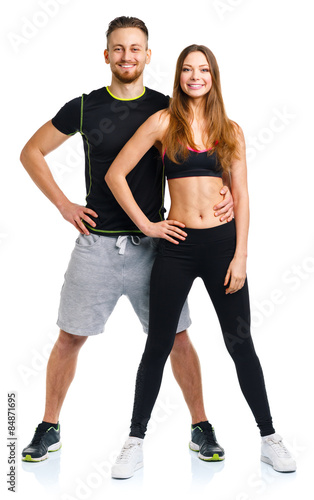 Sport couple - man and woman after fitness exercise on the white