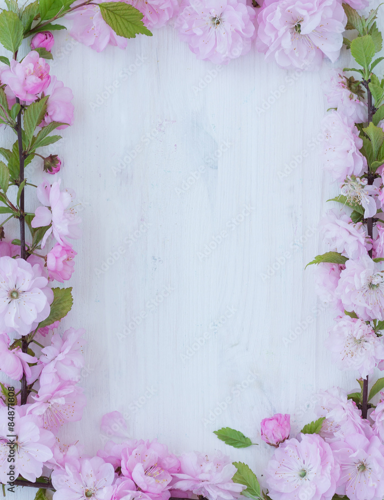 Flowers frame on wooden background Flowers frame on wooden background