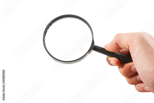hand holding a magnifier
