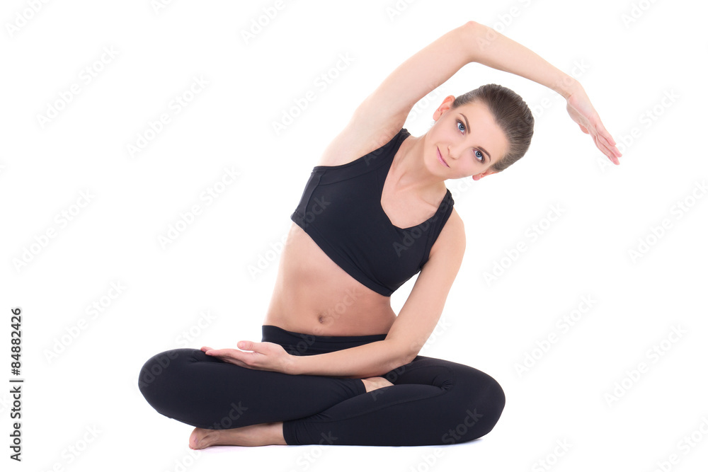 young beautiful woman doing stretching exercises isolated on whi young beautiful woman doing stretching exercises isolated on whi