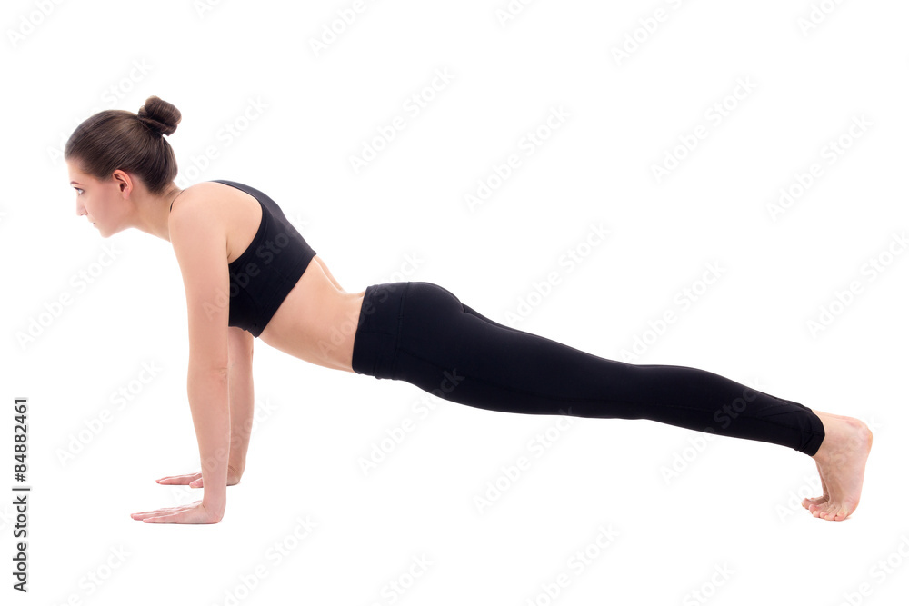 young slim woman doing push up exercise isolated on white young slim woman doing push up exercise isolated on white
