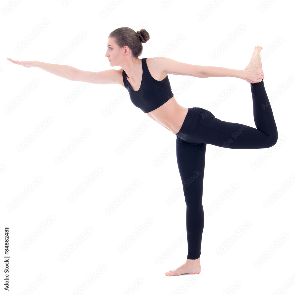 side view of slim woman standing in yoga pose isolated on white