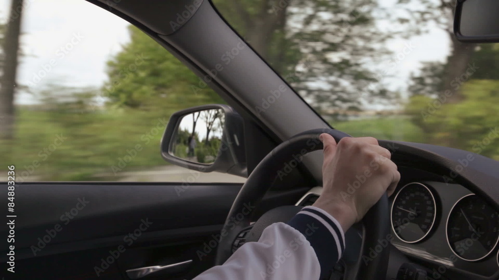 Caucasian man driving a car, Mounted camera, view of the steering wheel and dashboard. driving along the walkway and the sea, HD Caucasian man driving a car, Mounted camera, view of the steering wheel and dashboard. driving along the walkway and the sea, HD
