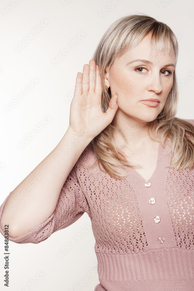 Fototapeta premium Young woman listening to gossip