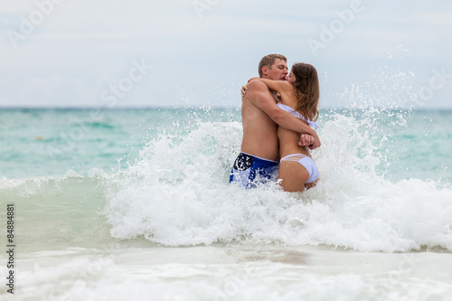 Beach couple walking on romantic travel