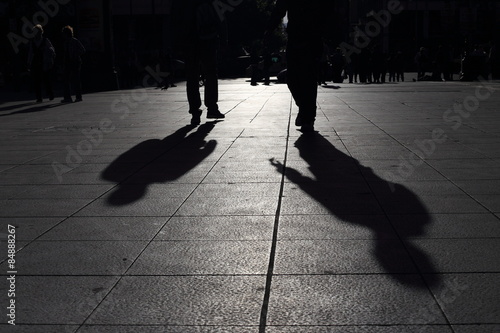 Obraz na płótnie Shadows of people walking in a street of the city, Athens w salonie