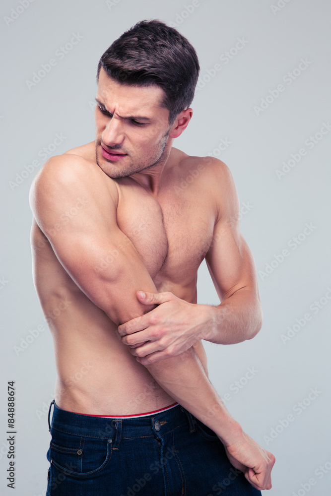 Fototapeta premium Handsome man having shoulder pain