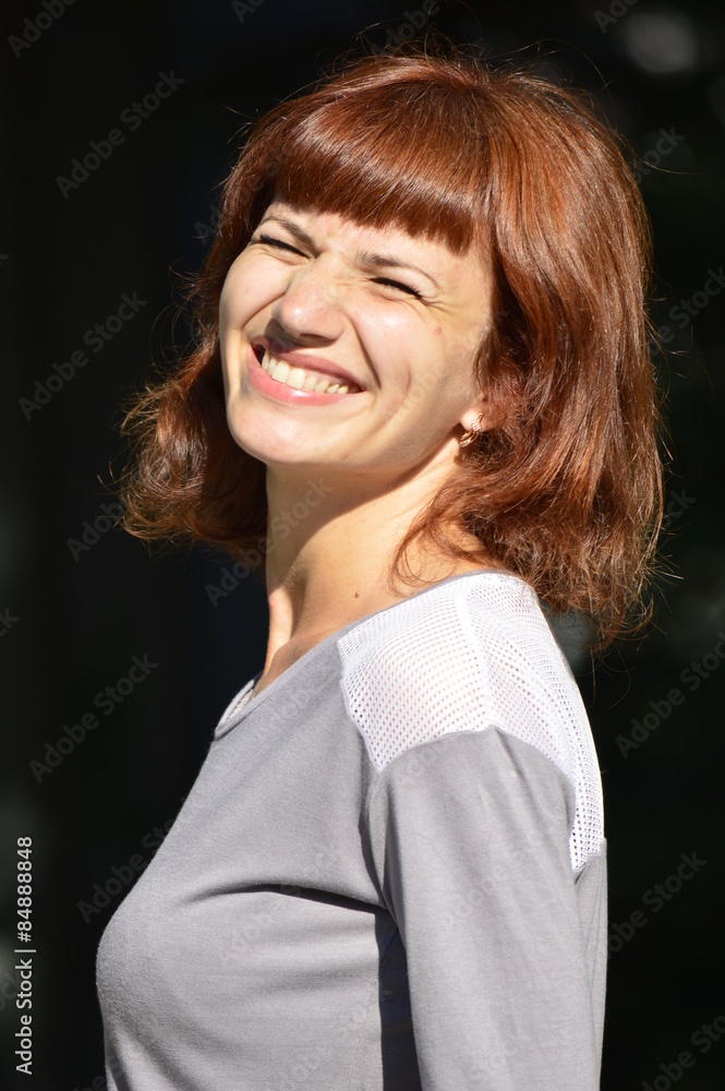 Fototapeta premium young woman wrinkled face from the sun and smiling