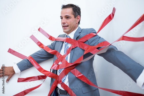 Businessman trapped by red tape