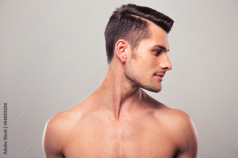 Handsome young man looking away