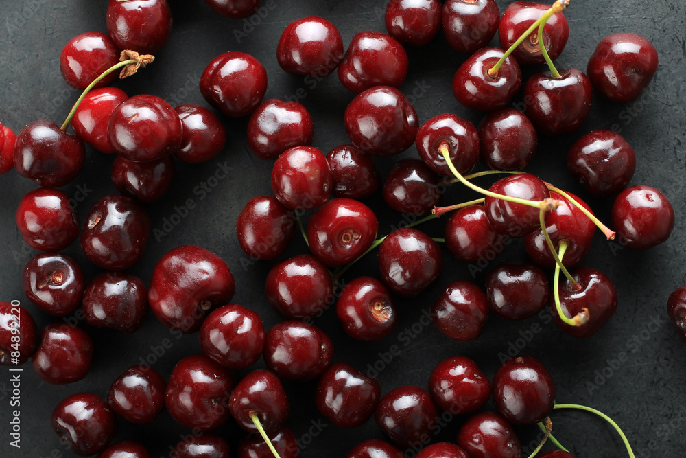 Fresh sweet cherries on a black background Fresh sweet cherries on a black background