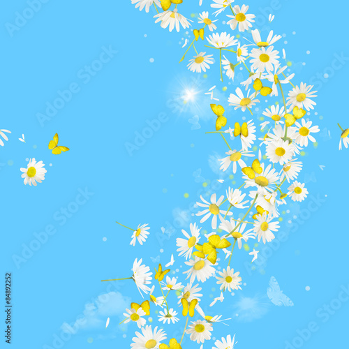 Fototapeta Naklejka Na Ścianę i Meble -  Breeze of daisies and butterflies, with bokeh circles and a sunbeam, repeatable and isolated on absolute blue