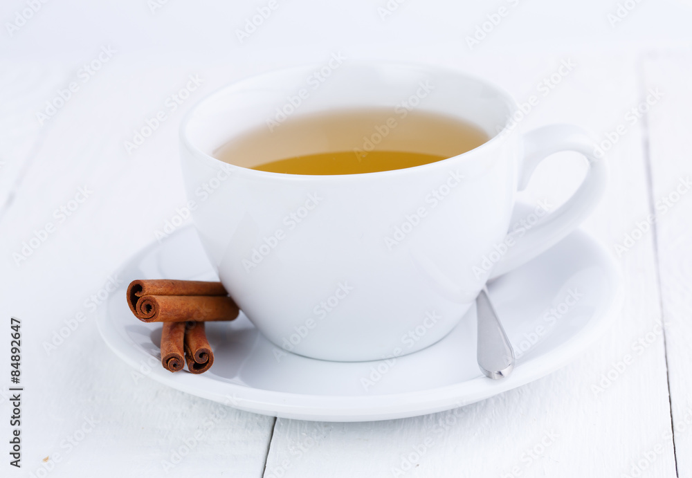 Green tea and cinnamon on wooden table. Green tea and cinnamon on wooden table.