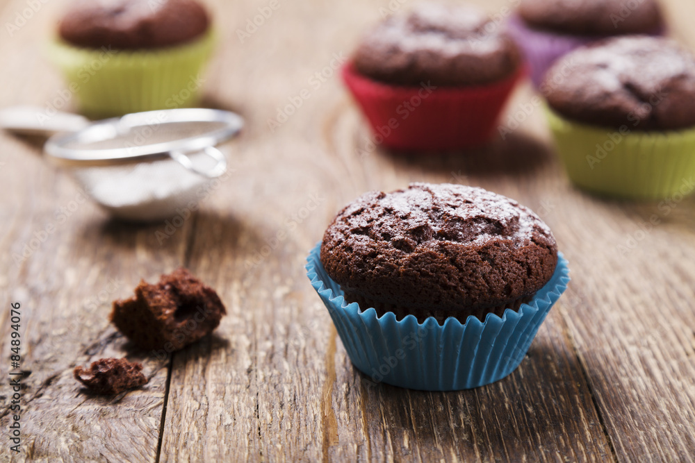 muffins with chocolate in colorful molds muffins with chocolate in colorful molds