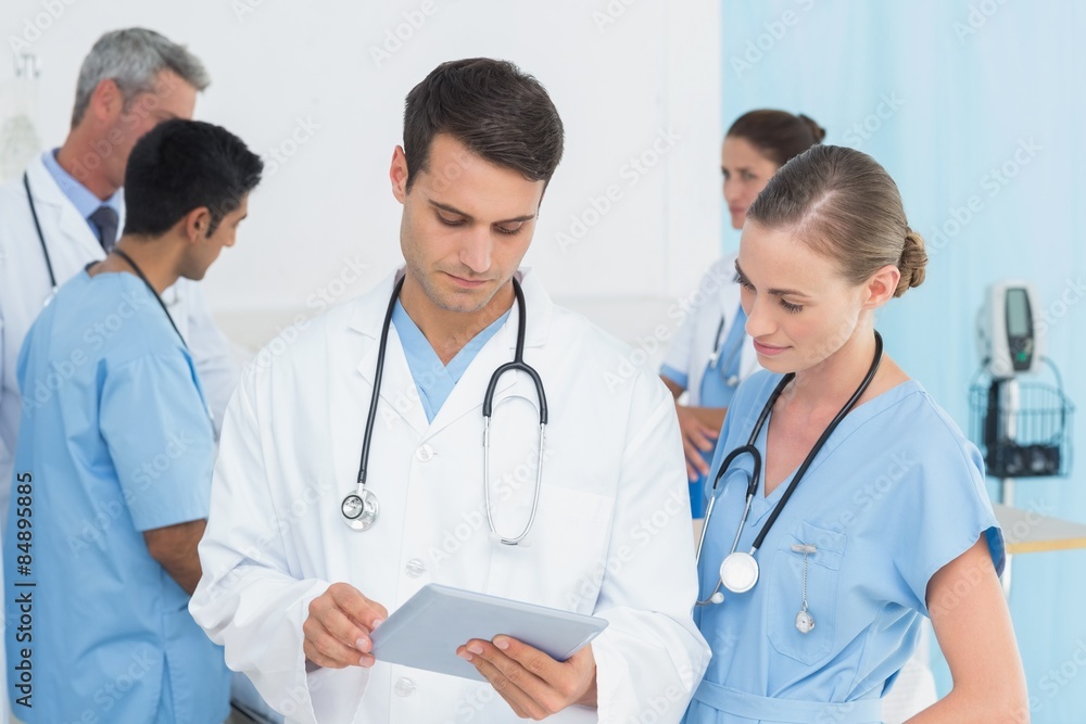 Report reading with colleagues and patient behind Report reading with colleagues and patient behind