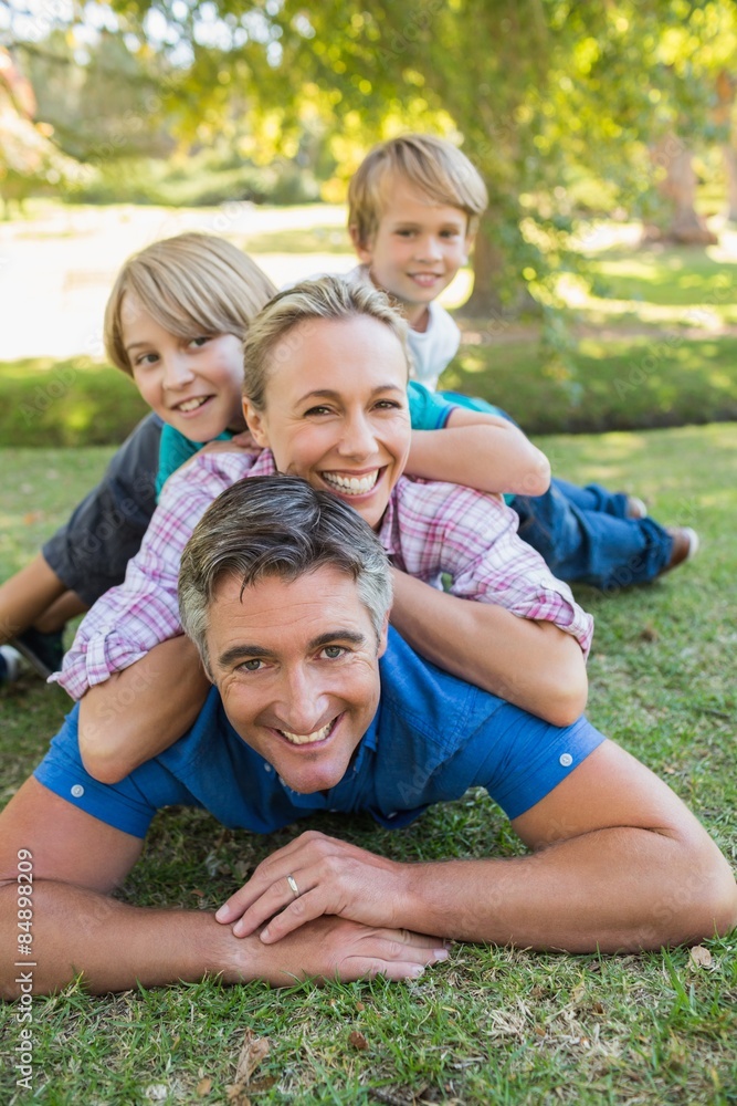 Happy family smiling at the camera 