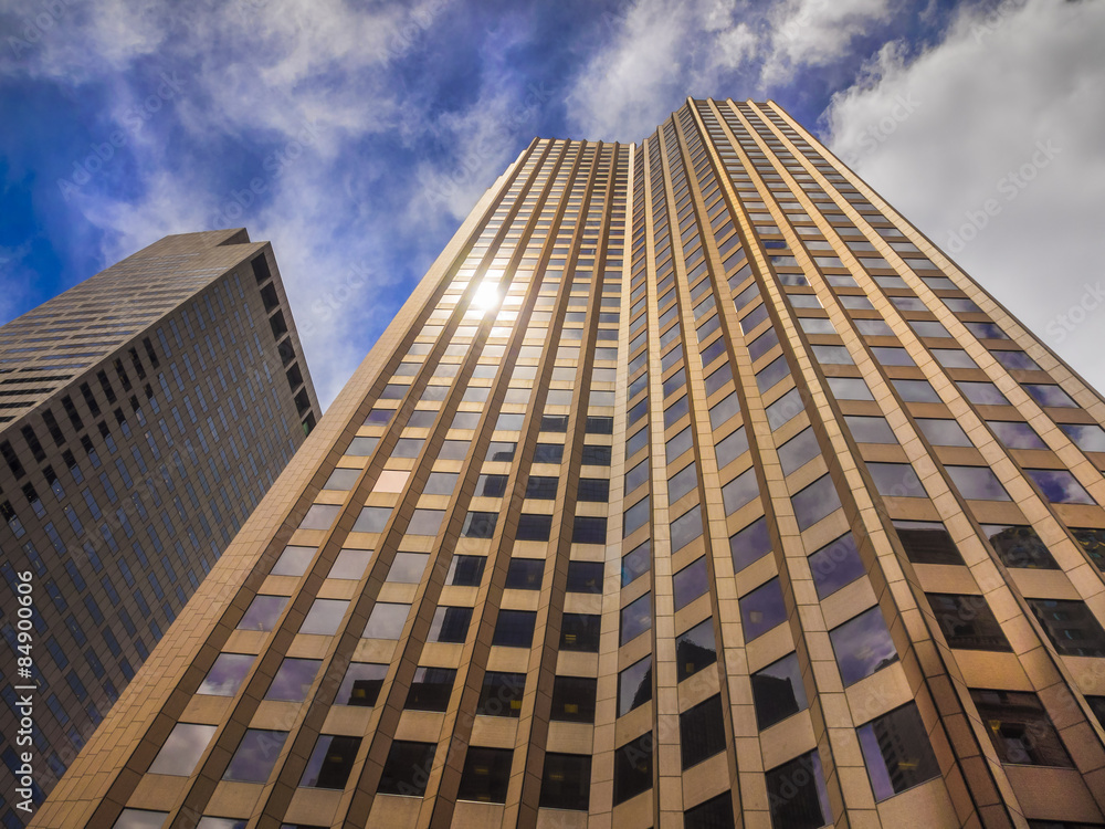 Glass and granite skyscraper building reaching for the sky in perspective