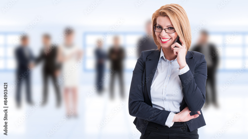 Happy smiling female business manager talking on the phone Happy smiling female business manager talking on the phone