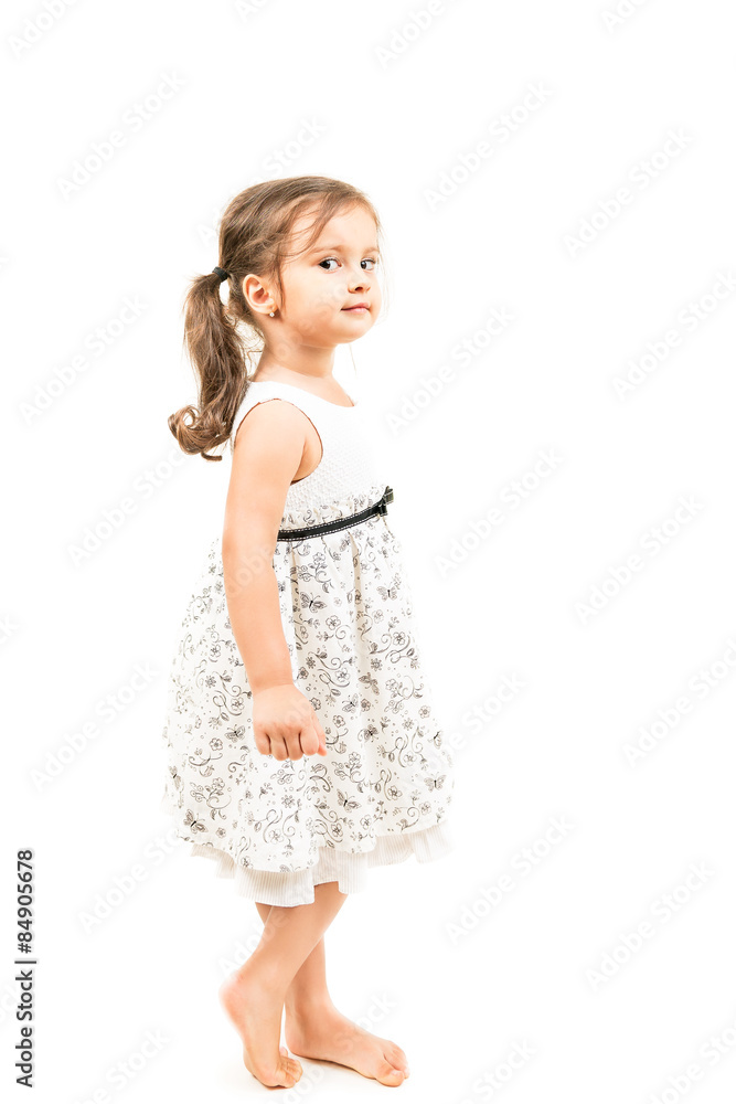 Cute little girl standing barefoot isolated Cute little girl standing barefoot isolated