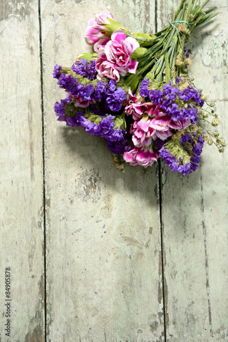 bunch of flowers on grunge wooden background