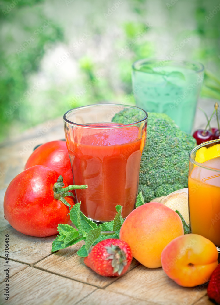 Tomato juice and other juices on table Tomato juice and other juices on table