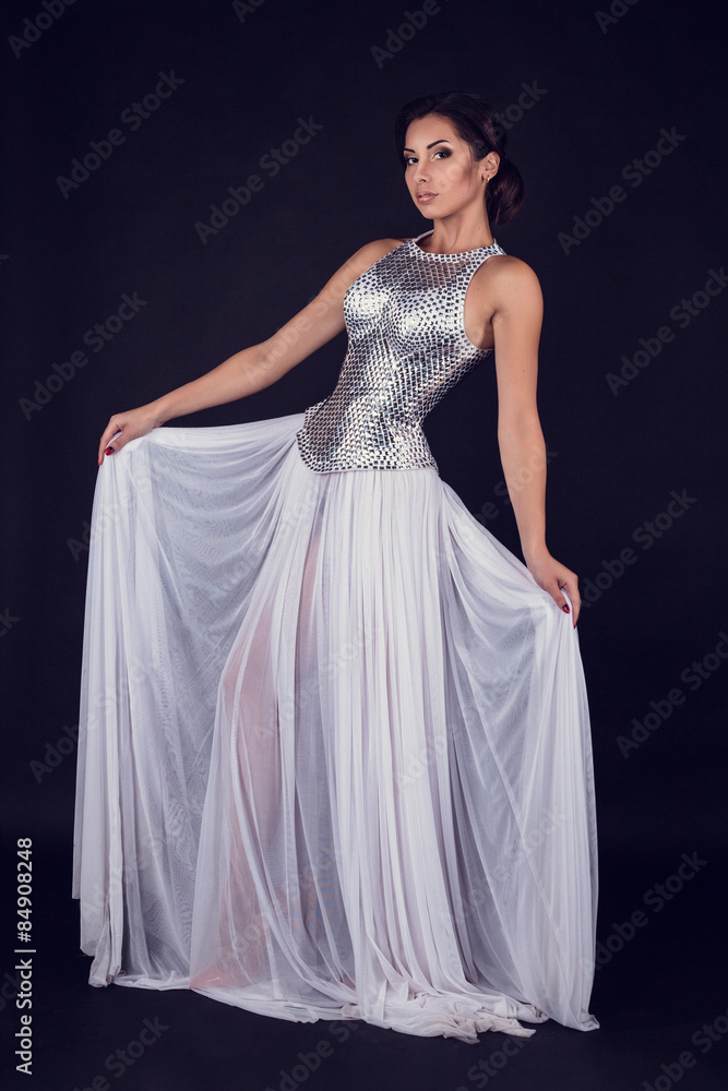 Pretty sexy girl full length posing in a fashion dress Pretty sexy girl full length posing in a fashion dress